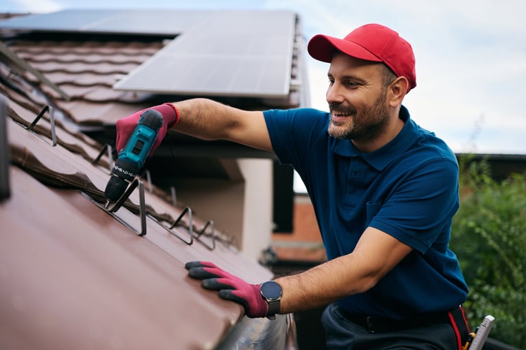 Happy roofer working on roof maintenance