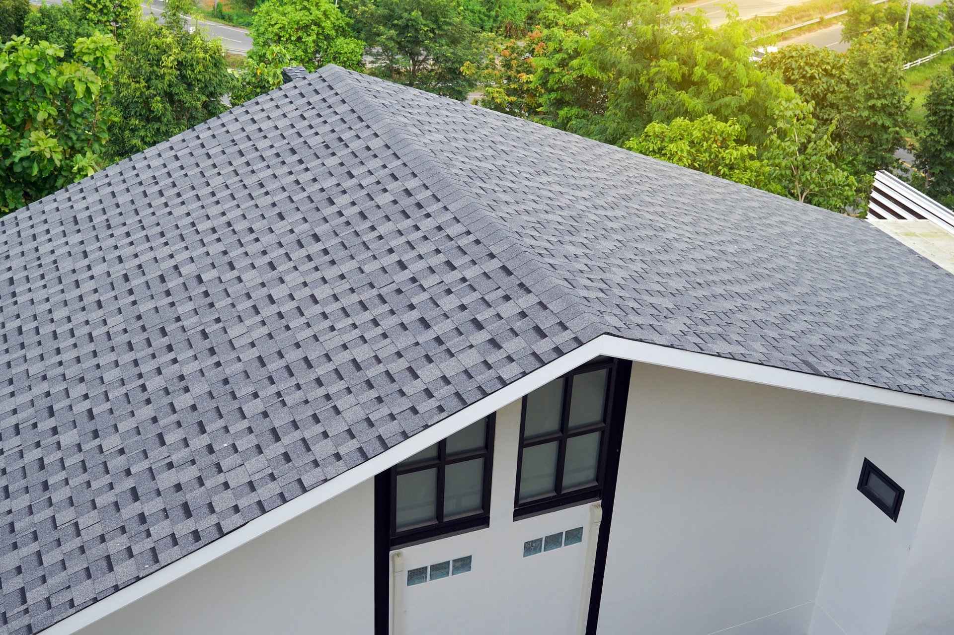 Modern house with gray asphalt shingle roof