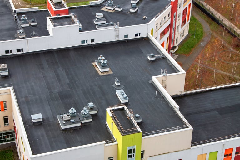 Modern multi-story building flat roof with ventilation systems